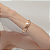 Conjunto de bracelete e brinco acetinado banho duplo - Imagem 5