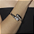 Bracelete liso com detalhe cravejado de zirconia cristal banho em rodio branco - Imagem 2