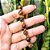 Pulseira de Olho de Tigre Natural com entremeio de Hematita Dourada - Imagem 3