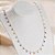 COLAR COM ZIRCONIAS PENDURADAS PP - Imagem 6