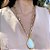 Colar Banhado com Verniz e Pingente Off White em Resina - Imagem 3