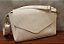 BOLSA DE OMBRO LATERAL 00301 OFF WHITE VERNIZ  / VERNIZ RISCADO - Imagem 1