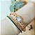 Bracelete em banho de ouro 18k cravejado de zircônias verde esmeralda - Imagem 2