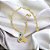 Pulseira cartier banhada em ouro 18k com mão de Fátima olho grego e mandala com zircônias - Imagem 3