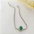 Pulseira em banho de ródio branco riviera com zircônias cristais e gota de pedra fusion verde esmeralda - Imagem 3