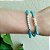 Pulseira elástica de cristais naturais em tons de azul e bolinhas banhadas em ouro 18k - Imagem 2