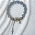 Pulseira de Miçanga com Pingente de Cruz, Fé e Espírito Santo - Imagem 4