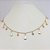 CHOKER FOLHEADO A OURO COM PENDURADOS E PEDRINHAS CRISTAL - Imagem 1