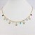 CHOKER FOLHEADO A OURO COM ESTRELINHAS DO MAR E PEDRINHAS EM ZIRCÔNIA COLORIDAS - Imagem 1