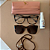 Kit Verão 🌴 - Clipon Camile marrom estampado + Cordão + Limpa lentes – por R$199,00 - Imagem 1