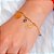 Pulseira com amuletos de sorte e proteção folheada em ouro 18k - Imagem 2