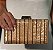 CLUTCH MADREPEROLA LISTRAS VERTICAIS - Imagem 1