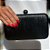 CLUTCH ARREDONDADA COURO METALIZADA PRETA - Imagem 1