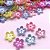 Miçanga flor irizada furo passante 100g- 830 peças - Imagem 1