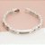 Pulseira Em Cerâmica Branca Com Detalhes Em Aço Com 9 Zircônias - Imagem 1