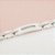 Pulseira Em Cerâmica Branca Com Detalhes Em Aço Com 9 Zircônias - Imagem 2