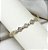 Bracelete REMI trevo cravejado com zirconia folheada a ouro - Imagem 1