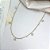 Colar CASTIEL estelas e pontos de luz folheado a ouro - Imagem 1