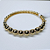 BRACELETE DOURADO DE BOLINHAS, METADE DO BRACELETE COM BOLINHAS LISA E ESPAÇADOR TODO CRAVEJADO - Imagem 1