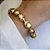 PULSEIRA DOURADA MEIA BOLA OVAL, LISA E FOSCA - Imagem 2