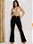 Calça jeans flare preta rasgada com bolsos funcionais - Imagem 1