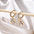 Brinco Argolinha de Click com Pingente de Lacinho Cravejado com Zircônias - Banhado a Ouro 18k - Imagem 2