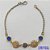 PULSEIRA NO BRUTO PRONTO PARA O BANHO(CX86) - PULSEIRA COM PINGENTES COM PALAVRA FÉ VAZADAS E VIDROS AZUIS - TAMANHO: 18CM COM FECHO LAGOSTA - PESO 2GR - BRU9541 - Imagem 1