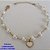 PULSEIRA NO BRUTO PRONTO PARA O BANHO - PULSEIRA TODA EM PÉROLA CORAÇÃO E PINGENTE CORAÇÃO TIPO VAN CLEEF MADRE PÉROLA EM RESINA 10MM - TAMANHO 18CM + EXTENSOR - PESO: 3,8GR - BRU12579 - Imagem 1