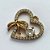 PINGENTE NO BRUTO PRONTO PARA O BANHO (CX08) - PINGENTE CORAÇÃO COM LAÇO CRAVEJADO EM MICROS ZIRCÔNIAS - COMPOSIÇÃO: LATÃO / ZIRCÔNIA - TAMANHO 17X17MM - PESO TOTAL 2,1GR - BRU12755 - Imagem 2