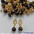 BRINCO FOLHEADO A OURO - BANHADO COM 5 MILÉSIMOS + VERNIZ DIAMOND -  BRINCO DE PINO COM PEDRA OLHO DE GATO 10MM - OURO234 - Imagem 1