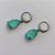 BRINCO EM AÇO INOXIDÁVEL - BRINCOS ARGOLAS DE PRESSÃO COM PINGENTES EM ZIRCÔNIAS VERDES 10X14MM - COMPOSIÇÃO: AÇO INOXIDÁVEL - AÇO1708 - Imagem 2