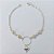 PULSEIRA FOLHEADA A PRATA COM 50 MILÉSIMOS + VERNIZ DIAMOND - PULSEIRA DUPLA 19CM COM PÉROLAS E CORAÇÃO DUPLO - PRA926 - Imagem 1