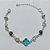 PULSEIRA FOLHEADA A PRATA COM 50 MILÉSIMOS + VERNIZ DIAMOND - PULSEIRA COM ELEMENTOS VAZADOS, ESFERAS LISTRADAS E TREVO TIPO VAN CLEEF AZUL - TAMANHO: 18CM + EXTENSOR - PRA1007 - Imagem 1