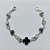 PULSEIRA FOLHEADA A PRATA COM 50 MILÉSIMOS + VERNIZ DIAMOND - PULSEIRA COM ELEMENTOS VAZADOS, ESFERAS LISTRADAS E TREVO TIPO VAN CLEEF PRETO - TAMANHO: 18CM - PRA1008 - Imagem 1