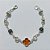 PULSEIRA FOLHEADA A PRATA COM 50 MILÉSIMOS + VERNIZ DIAMOND - PULSEIRA COM ELEMENTOS VAZADOS, ESFERAS LISTRADAS E TREVO TIPO VAN CLEEF MARROM - TAMANHO: 18CM - PRA1010 - Imagem 1