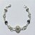 PULSEIRA FOLHEADA A PRATA COM 50 MILÉSIMOS + VERNIZ DIAMOND - PULSEIRA COM ELEMENTOS VAZADOS, ESFERAS LISTRADAS E ESFERA VAZADA - TAMANHO: 18CM - PRA1011 - Imagem 1