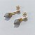BRINCO FOLHEADO A OURO - BANHADO COM 5 MILÉSIMOS + VERNIZ DIAMOND - BRINCO DE PINO BASE GOTA E PEDRA NATURAL LILÁS 8MM - OURO1377 - Imagem 2