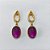 BRINCO FOLHEADO A OURO - BANHADO COM 5 MILÉSIMOS + VERNIZ DIAMOND - BRINCO DE PINO BASE OVAL E PEDRA NATURAL OVAL ROXA 20MM - OURO1380 - Imagem 1