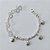 PULSEIRA FOLHEADA A PRATA COM 50 MILÉSIMOS + VERNIZ DIAMOND - PULSEIRA COM ACRÍLICOS E PINGENTES GOTAS COM PALAVRAS - TAMANHO: 19CM - PRA1022 - Imagem 1