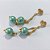 BRINCO FOLHEADO A OURO - BANHADO COM 5 MILÉSIMOS + VERNIZ DIAMOND - BRINCO DE PINO BASE VAZADA E PÉROLAS AZUIS 12MM - OURO1426 - Imagem 2