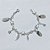 PULSEIRA FOLHEADA A PRATA COM 50 MILÉSIMOS + VERNIZ DIAMOND - PULSEIRA INFANTIL 13CM COM TARTARUGAS - PRA1106 - Imagem 1