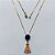 GARGANTILHA NO BRUTO PRONTA PARA O BANHO(CX187) - GARGANTILHA COM CORRENTE 45M E PINGENTE EM ZIRCÔNIA REDONDA AZUL E NOSSA SRA CRAVEJADA 23MM - PESO: 4,7GR - COMPOSIÇÃO LATÃO / ZIRCÔNIA - BRU27105 - Imagem 1
