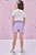 Conjunto de Blusa em Meia Malha e Short Saia em Molevisco Lilás Kukiê - Imagem 5