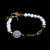 Pulseira Key Design Montero de Pérola Natural Branca e Aço Dourado - Imagem 1