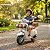 Mini Moto Elétrica Infantil Vespa Primavera 12v Branca Licenciada Com Luz Som Rodinhas Auxiliares Até 30kg - Imagem 6