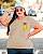 T-SHIRT PLUS SIZE ALEGRIA DIVERTIDAMENTE DTF BEGE XG - Imagem 1