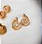 Brinco caracol com zirconias - Imagem 1