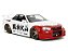 Nissan Skyline GT-R (R34) 2002 Street Fighter + Figura Ryu Jada Toys 1:24 - Imagem 4