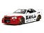 Nissan Skyline GT-R (R34) 2002 Street Fighter + Figura Ryu Jada Toys 1:24 - Imagem 2