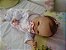 Bebê reborn kit nacional Tatá com 1,640 kg e 43 cm, cabelinhos implantados, olhos castanhos - Imagem 1